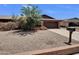 A well-landscaped front yard featuring drought-resistant plants, offering an inviting curb appeal to this charming home at 4509 E Joan De Arc Ave, Phoenix, AZ 85032