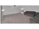 Spacious living room with neutral carpeting and ample natural light, offering a comfortable and inviting atmosphere at 4509 E Joan De Arc Ave, Phoenix, AZ 85032