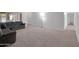 Expansive living area with plush carpeting, highlighting the room's generous size and layout at 4509 E Joan De Arc Ave, Phoenix, AZ 85032