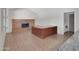 Versatile room with a brick fireplace, built-in desk, and tiled floor, suitable for a home office or den at 4509 E Joan De Arc Ave, Phoenix, AZ 85032