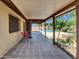 Covered patio featuring tile and view to swimming pool at 4509 E Joan De Arc Ave, Phoenix, AZ 85032
