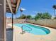 A sparkling backyard pool offers a cool retreat, enhanced by palm trees, clear skies, and lush landscaping at 4509 E Joan De Arc Ave, Phoenix, AZ 85032