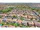 An aerial shot showcases a neighborhood's layout with a pool in the backyard of the home at 45131 W Horse Mesa Rd, Maricopa, AZ 85139