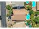 Overhead view of backyard with a pool, covered patio, some trees and desert landscaping at 45131 W Horse Mesa Rd, Maricopa, AZ 85139