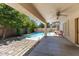 Inviting outdoor space features a pool, patio, and desert landscaping at 45131 W Horse Mesa Rd, Maricopa, AZ 85139