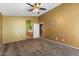 Comfortable bedroom featuring plush carpeting and an ensuite bathroom at 45131 W Horse Mesa Rd, Maricopa, AZ 85139