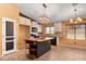 Bright kitchen with white cabinets, butcher block island and mosaic backsplash at 45131 W Horse Mesa Rd, Maricopa, AZ 85139