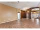 Spacious living room features an open layout, wood-look floors, and high ceilings at 45131 W Horse Mesa Rd, Maricopa, AZ 85139