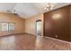 Spacious living room with wood floors, ceiling fan, and neutral paint at 45131 W Horse Mesa Rd, Maricopa, AZ 85139