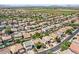 Aerial view of a lovely suburban neighborhood with lush green lawns and mature trees at 45131 W Horse Mesa Rd, Maricopa, AZ 85139