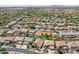Aerial view of home with a pool in a community with mature trees and desert landscaping at 45131 W Horse Mesa Rd, Maricopa, AZ 85139