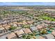 Aerial view of home with backyard pool in a residential neighborhood with lush landscaping at 45131 W Horse Mesa Rd, Maricopa, AZ 85139