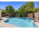 Backyard oasis features a sparkling pool and lush landscaping at 45131 W Horse Mesa Rd, Maricopa, AZ 85139
