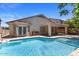 Relaxing pool area with covered patio and lush landscape at 45131 W Horse Mesa Rd, Maricopa, AZ 85139