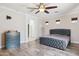 Primary suite featuring a ceiling fan, modern decor and natural light at 46141 W Rainbow Dr, Maricopa, AZ 85139
