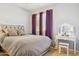 Bright bedroom featuring soft natural light, plush carpet and vanity at 46141 W Rainbow Dr, Maricopa, AZ 85139