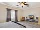 Relaxing bedroom showcases a ceiling fan, and calming natural light at 46141 W Rainbow Dr, Maricopa, AZ 85139