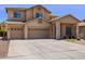 Charming two-story home with a well-maintained yard and convenient three-car garage, offering curb appeal and functionality at 46141 W Rainbow Dr, Maricopa, AZ 85139