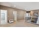 Open hallway with multiple doorways and access to various rooms with neutral tones throughout at 46141 W Rainbow Dr, Maricopa, AZ 85139