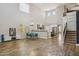 Open floor plan with high ceilings, dining area and sleek wood-look floors at 46141 W Rainbow Dr, Maricopa, AZ 85139