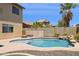 Backyard pool features a large pool, a firepit, and a palm tree for warm sunny days at 46141 W Rainbow Dr, Maricopa, AZ 85139
