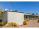 View of the backyard, showing desert landscaping, storage shed and screen enclosed patio at 5309 E Butte St, Mesa, AZ 85205
