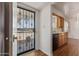 Inviting entryway with a decorative security door, adjacent to the kitchen with wood floors at 5309 E Butte St, Mesa, AZ 85205