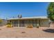 Back of house with screened-in patio at 5309 E Butte St, Mesa, AZ 85205