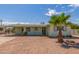 Charming single-story home with desert landscaping, a palm tree, and a covered parking area at 5309 E Butte St, Mesa, AZ 85205