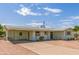 Lovely single-story house with a covered patio, desert landscaping, and a spacious driveway at 5309 E Butte St, Mesa, AZ 85205