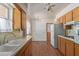 Quaint kitchen with wood floors, ample cabinet space, and an eat-in dining area at 5309 E Butte St, Mesa, AZ 85205