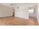 Spacious living room featuring wood floors, a ceiling fan, and ample natural light at 5309 E Butte St, Mesa, AZ 85205