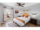 Bedroom featuring wood-look floors, modern decor, and window view to front yard at 5343 W Vogel Ave, Glendale, AZ 85302