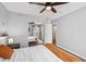 Bedroom featuring wood-look floors, modern decor, ceiling fan, and closet at 5343 W Vogel Ave, Glendale, AZ 85302