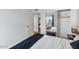 Bedroom featuring wood-look floors, modern decor, and mirrored closet at 5343 W Vogel Ave, Glendale, AZ 85302