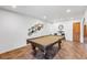 Spacious game room is equipped with a pool table and decor at 5343 W Vogel Ave, Glendale, AZ 85302