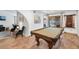 Entertain in the game room complete with a pool table and view of the outdoor pool at 5343 W Vogel Ave, Glendale, AZ 85302