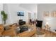 Spacious living area with modern furnishings, a corner fireplace, and TV at 5343 W Vogel Ave, Glendale, AZ 85302
