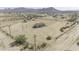 Aerial view of the property with open desert surrounding at 53925 W Stallion Rd, Maricopa, AZ 85139
