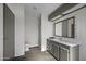Bathroom with vanity, mirror, and shower, offering a clean and functional space at 53925 W Stallion Rd, Maricopa, AZ 85139