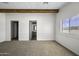 Bright carpeted bedroom with a closet and access to an ensuite bathroom at 53925 W Stallion Rd, Maricopa, AZ 85139
