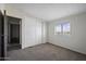Bedroom with neutral carpet, a sliding door closet and a window for natural light at 53925 W Stallion Rd, Maricopa, AZ 85139
