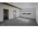 Bright bedroom with large windows and closet, offering comfort and style at 53925 W Stallion Rd, Maricopa, AZ 85139