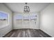 Dining room featuring a modern light fixture and scenic views from multiple windows at 53925 W Stallion Rd, Maricopa, AZ 85139