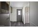 The entryway has a door with a window, and cabinets for storage at 53925 W Stallion Rd, Maricopa, AZ 85139