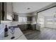 Modern kitchen with a tile backsplash and stainless steel sink at 53925 W Stallion Rd, Maricopa, AZ 85139