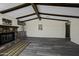 Spacious living room with wood floors, a fireplace, and wooden beam ceilings at 53925 W Stallion Rd, Maricopa, AZ 85139