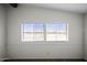 Bright room with two windows offering an exterior view at 53925 W Stallion Rd, Maricopa, AZ 85139
