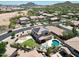 Aerial view of the neighborhood showcasing a well-maintained home with a pool and outdoor living spaces at 6712 W Miner Trl, Peoria, AZ 85383