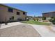Spacious backyard with lush lawn, a walkway, a patio, and mature landscaping, great for outdoor living at 6712 W Miner Trl, Peoria, AZ 85383